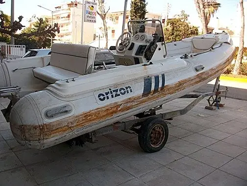 Rubbing strake replacement and tube cleaning on an Orizon inflatable boat, before