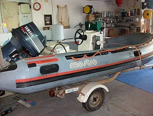 Tube reinforcement and cleaning on a Mostro inflatable boat, before