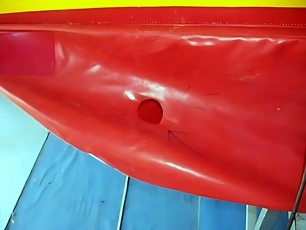 Valve and D-ring replacement on a PVC inflatable banana, before