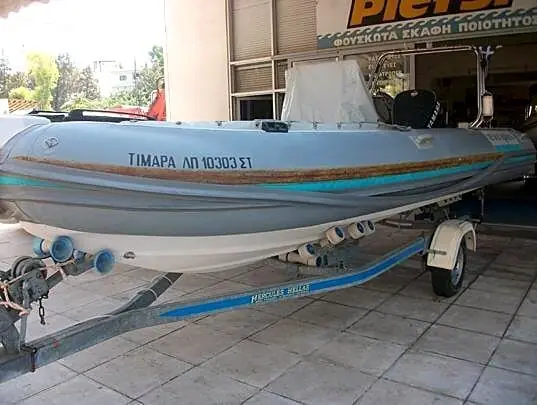 PVC rubbing strake replacement on an Evripus inflatable boat, before